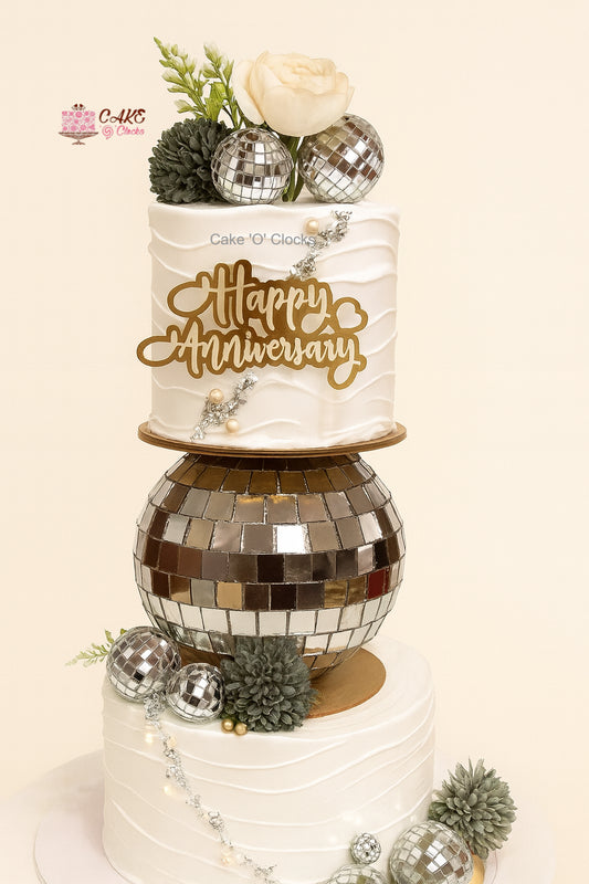 Elegant White Anniversary Revolving Cake